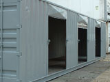 storage container custom modified to include rollup doors with lock box